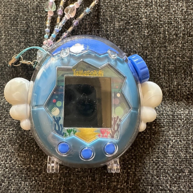ใหม่ในสต็อก! เคสป้องกันแทมาก็อ - Bandai Model Tamagotchi บทวิจารณ์และราคา